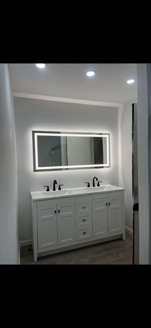 Bathroom double vanity and illuminated mirror